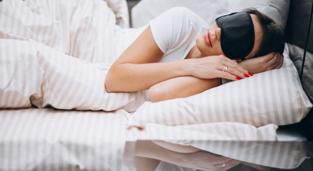Young woman resting in bed in the morning